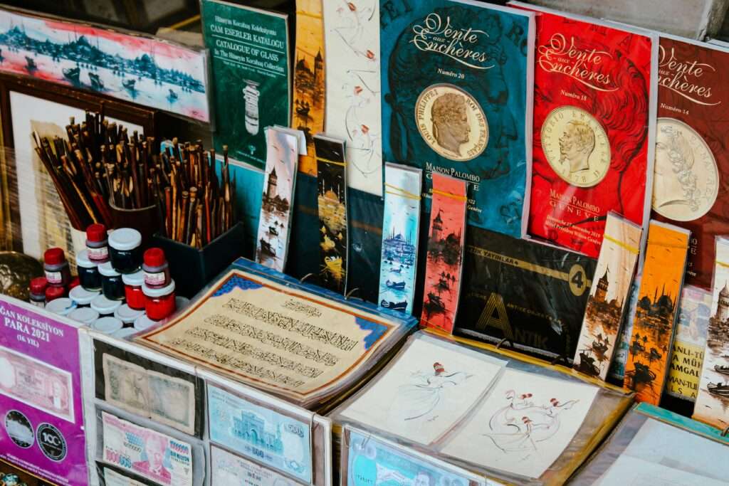 Vibrant display of calligraphy pieces, books, and souvenirs in Istanbul market.